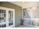 Cozy screened-in porch with ceiling fan, outdoor view, and french doors to interior at 159 Valhalla Dr, Timberlake, NC 27583
