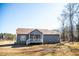 A charming single-story home featuring a screened porch, gray siding and a well-maintained lawn at 159 Valhalla Dr, Timberlake, NC 27583