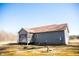 View of a home featuring a screened back porch, perfect for outdoor enjoyment and relaxation at 159 Valhalla Dr, Timberlake, NC 27583