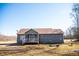 A charming single-story home featuring a screened porch, gray siding and a well-maintained lawn at 159 Valhalla Dr, Timberlake, NC 27583