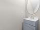 Modern bathroom with updated vanity and a round mirror at 1707 Stroll Cir, Fuquay Varina, NC 27526