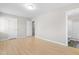 Bright, expansive bedroom with hardwood floors and access to a full bathroom at 1707 Stroll Cir, Fuquay Varina, NC 27526