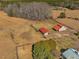 Expansive property showcasing lush greenery, large outbuildings, and a tranquil setting in the countryside at 1834 Dewitt Smith Rd, Pittsboro, NC 27312