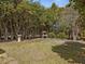 Backyard featuring a lush garden with mature trees and foliage at 1834 Dewitt Smith Rd, Pittsboro, NC 27312