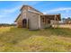 Exterior view of a charming barn with weathered wood and a metal roof, adding rustic charm to the property at 1834 Dewitt Smith Rd, Pittsboro, NC 27312