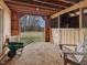 Interior view of a horse stall featuring wood construction, chair, and view to paddock at 1834 Dewitt Smith Rd, Pittsboro, NC 27312