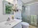 Clean bathroom featuring shower stall, sleek vanity, and window view at 1834 Dewitt Smith Rd, Pittsboro, NC 27312
