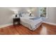 Bedroom with hardwood floors, ample lighting, and large windows with natural light at 1834 Dewitt Smith Rd, Pittsboro, NC 27312