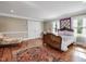 Spacious bedroom with hardwood floors, natural light, and ample room for furniture at 1834 Dewitt Smith Rd, Pittsboro, NC 27312