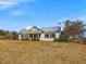 Charming one-story home with a metal roof, white painted brick and a covered front porch at 1834 Dewitt Smith Rd, Pittsboro, NC 27312