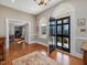 Welcoming foyer boasts hardwood floors, natural light, and an elegant doorway at 1834 Dewitt Smith Rd, Pittsboro, NC 27312
