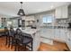 Bright and airy kitchen with custom cabinets, granite countertops, and a center island at 1834 Dewitt Smith Rd, Pittsboro, NC 27312