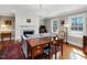 Cozy living room with a fireplace, hardwood floors, and elegant decor at 1834 Dewitt Smith Rd, Pittsboro, NC 27312