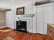 Elegant living room featuring a fireplace with decorative mantel and hardwood floors at 1834 Dewitt Smith Rd, Pittsboro, NC 27312