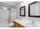 Bright bathroom with double sinks and white shower curtain at 2006 Chedington Dr, Apex, NC 27502