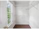 Walk-in closet with white shelving at 2006 Chedington Dr, Apex, NC 27502