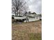 Side view of the home, showing a back entrance with a covered carport or patio at 2009 Windy Hill Farm Ln, Zebulon, NC 27597
