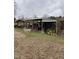 Exterior view of shed featuring open front and cluttered with miscellaneous items at 2009 Windy Hill Farm Ln, Zebulon, NC 27597