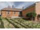 Expansive backyard with a concrete patio and a well-maintained grassy lawn at 2504 Churchill Dr, Burlington, NC 27215