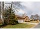 Traditional brick home with attached two-car garage and a well-manicured front lawn at 2504 Churchill Dr, Burlington, NC 27215