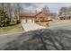Charming brick home with a three-car garage and well-manicured lawn on a corner lot at 2504 Churchill Dr, Burlington, NC 27215