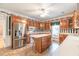 Traditional eat-in kitchen with wooden cabinets, a center island and stainless steel appliances at 2504 Churchill Dr, Burlington, NC 27215