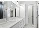 Bright bathroom featuring double sinks, a large mirror, and modern fixtures at 2728 Milburnie Rd, Raleigh, NC 27610