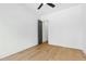 Spacious bedroom features hardwood floors, a modern ceiling fan, and crisp, white walls at 2728 Milburnie Rd, Raleigh, NC 27610