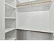 Bright, walk-in closet with shelving, hanging rod, and ample storage space at 2728 Milburnie Rd, Raleigh, NC 27610