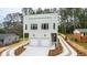Beautiful two-story home with a modern design, two-car garage, and newly landscaped front yard at 2728 Milburnie Rd, Raleigh, NC 27610