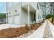 Modern home with a two-car garage, landscaped front yard, and inviting entryway at 2728 Milburnie Rd, Raleigh, NC 27610