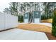 Backyard of home featuring concrete patio and modern privacy fence near wooded area at 2728 Milburnie Rd, Raleigh, NC 27610