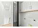 Conveniently located laundry room with modern cabinetry and stylish barn door at 2728 Milburnie Rd, Raleigh, NC 27610