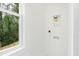 Well-lit laundry room with connections for a washer and dryer, offering convenience and functionality at 2728 Milburnie Rd, Raleigh, NC 27610
