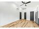 Bright living room with hardwood floors, modern fixtures, white walls and contemporary design at 2728 Milburnie Rd, Raleigh, NC 27610