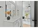 Bathroom featuring a modern vanity with a sleek faucet and contemporary decor elements at 2730 Milburnie Rd, Raleigh, NC 27610