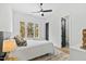 Inviting bedroom featuring a comfortable bed, a large window, and access to an ensuite bathroom at 2730 Milburnie Rd, Raleigh, NC 27610