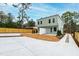 View of side yard with concrete patio, fence, and light green siding at 2730 Milburnie Rd, Raleigh, NC 27610