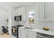 Modern kitchen featuring white cabinets, stainless steel appliances, and a bright window view at 2730 Milburnie Rd, Raleigh, NC 27610