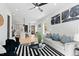 Spacious living room featuring modern decor, with an open view of the modern kitchen and dining area at 2730 Milburnie Rd, Raleigh, NC 27610