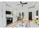Bright living room with modern kitchen, stainless steel appliances, and light hardwood floors at 2730 Milburnie Rd, Raleigh, NC 27610