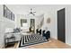 Modern living room features sleek furnishings, a bold striped rug, and a stylish ceiling fan at 2730 Milburnie Rd, Raleigh, NC 27610