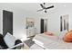 Comfortable main bedroom features sleek decor, a modern ceiling fan, and ample natural light at 2730 Milburnie Rd, Raleigh, NC 27610