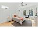 Sunlit main bedroom features modern decor, neutral colors, and a ceiling fan at 2730 Milburnie Rd, Raleigh, NC 27610