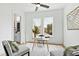Bright office space with a modern desk, stylish chairs, and natural light from a large window at 2730 Milburnie Rd, Raleigh, NC 27610