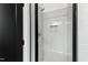 Modern shower with glass door, light gray tile, and sleek fixtures at 2730 Milburnie Rd, Raleigh, NC 27610