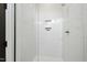 Modern shower featuring white subway tiles, a built-in niche, and sleek chrome fixtures at 2730 Milburnie Rd, Raleigh, NC 27610