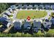An aerial shot of a residential neighborhood with well-kept lawns and houses with backyard patios at 286 Two Creeks Lp, Chapel Hill, NC 27517