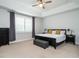 Inviting bedroom showcases a tray ceiling, a large window, and comfortable neutral decor at 286 Two Creeks Lp, Chapel Hill, NC 27517