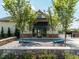 Inviting clubhouse entrance framed by trees, with stone accents and a welcoming facade at 286 Two Creeks Lp, Chapel Hill, NC 27517